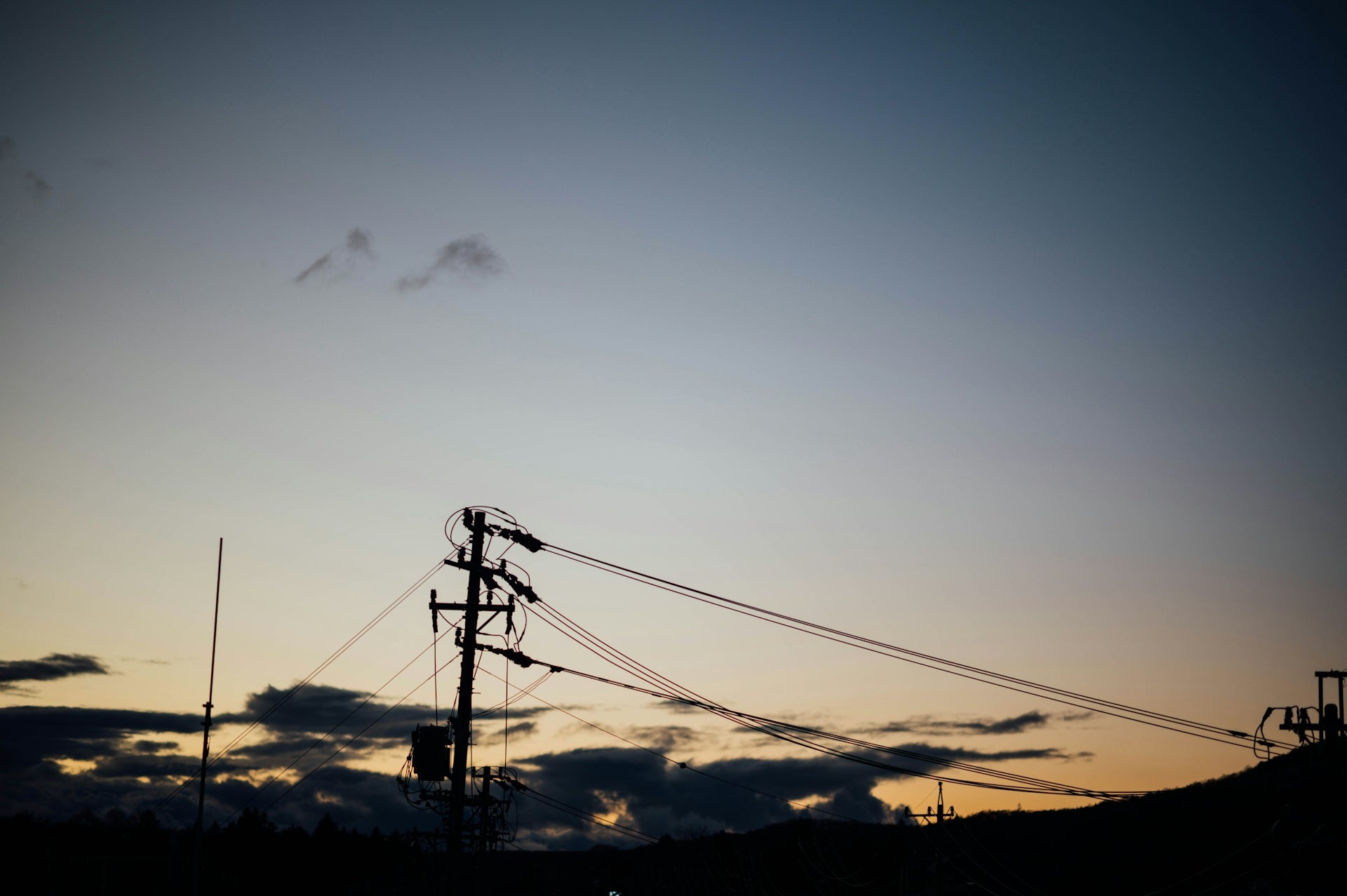black electric post at sunset