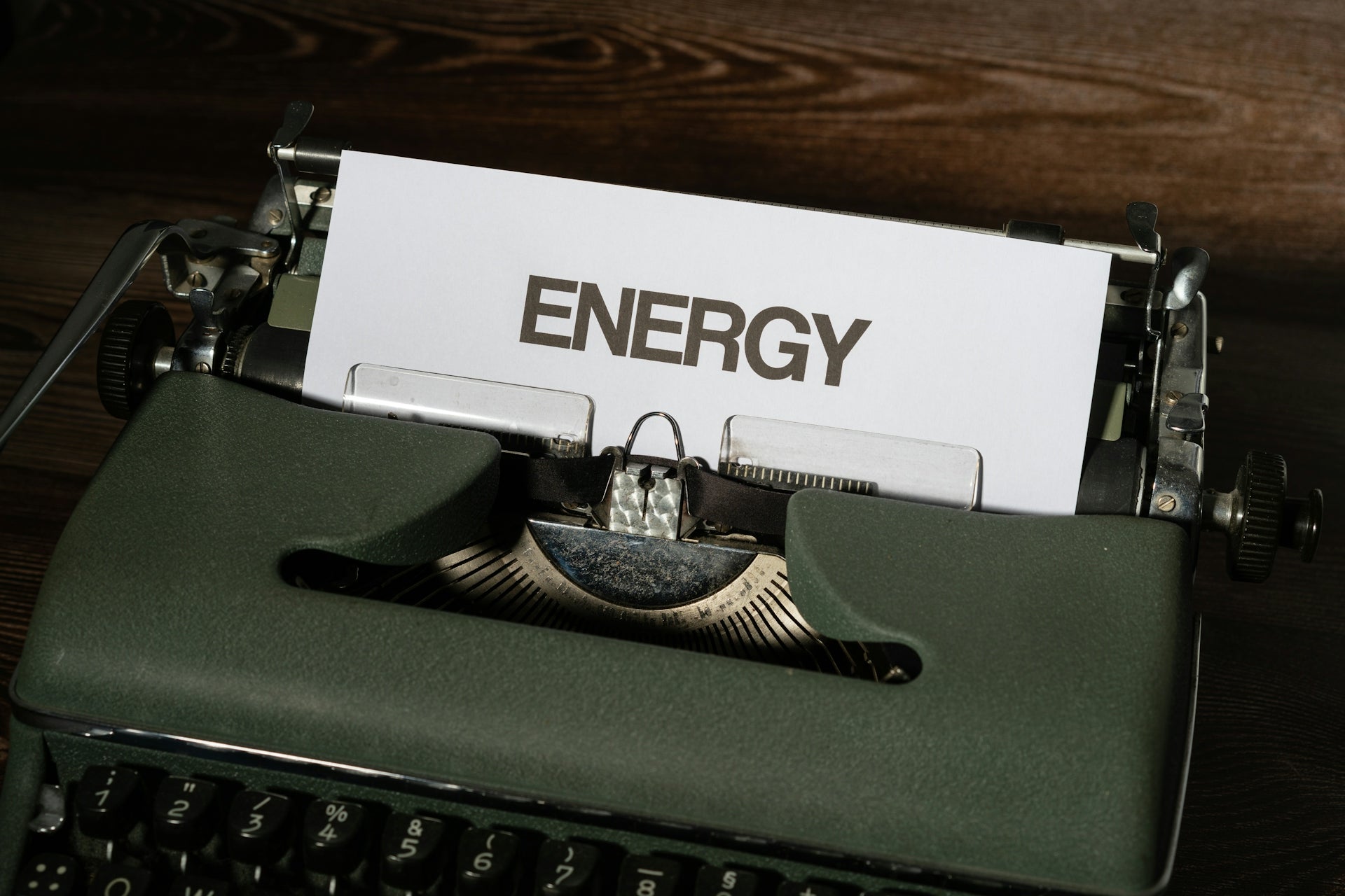 a close up of a typewriter with a sign on it